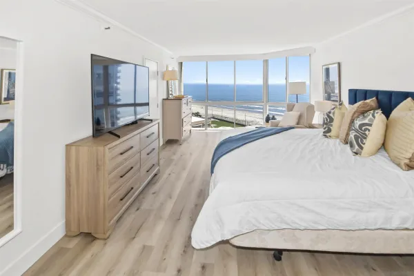 a spacious bedroom with a bed and window