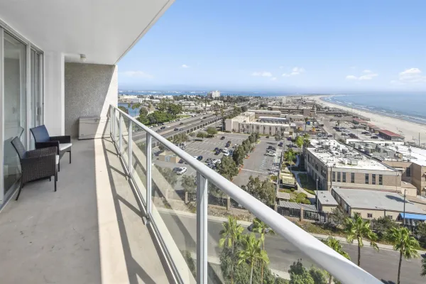 a view of balcony with wooden floor
