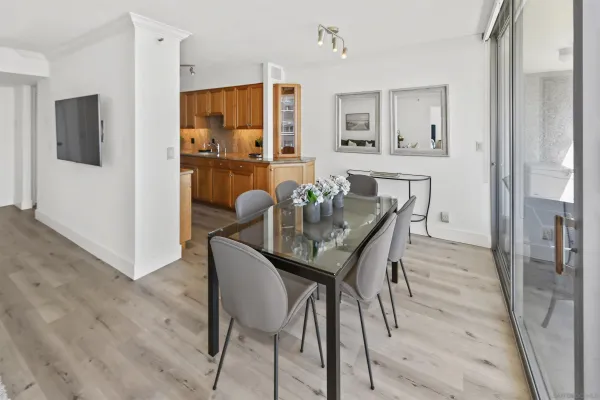 a dining room with furniture and window
