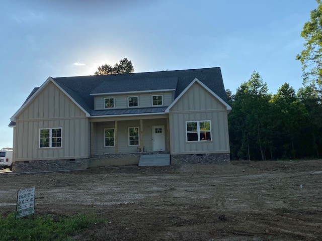1624 Porter Road Burns, TN 37029 - Photo 1 of 4 front view of house with a yard