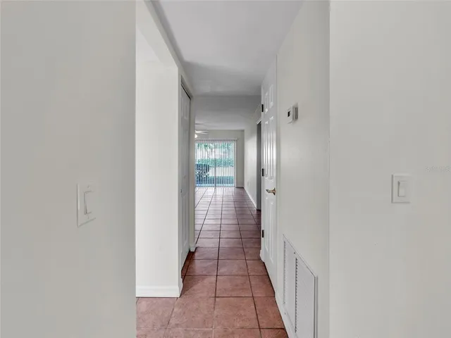 a view of a hallway with white walls