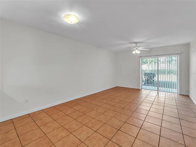 a view of a bedroom with a large bed and a chandelier