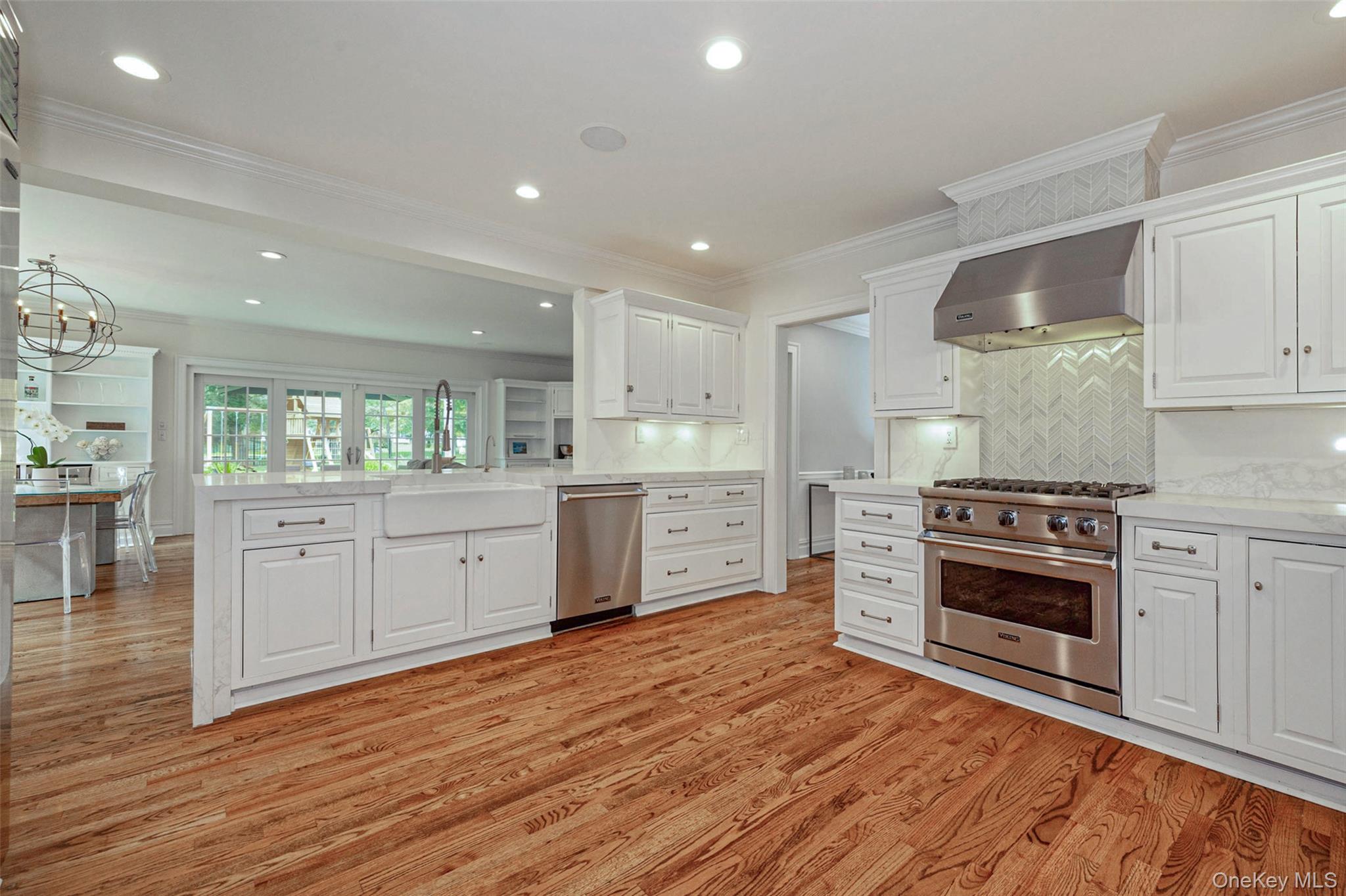 18 Lakeside Drive Rye, NY 10580 - Photo 11 of 43 a kitchen with stainless steel appliances granite countertop a stove a sink and a refrigerator
