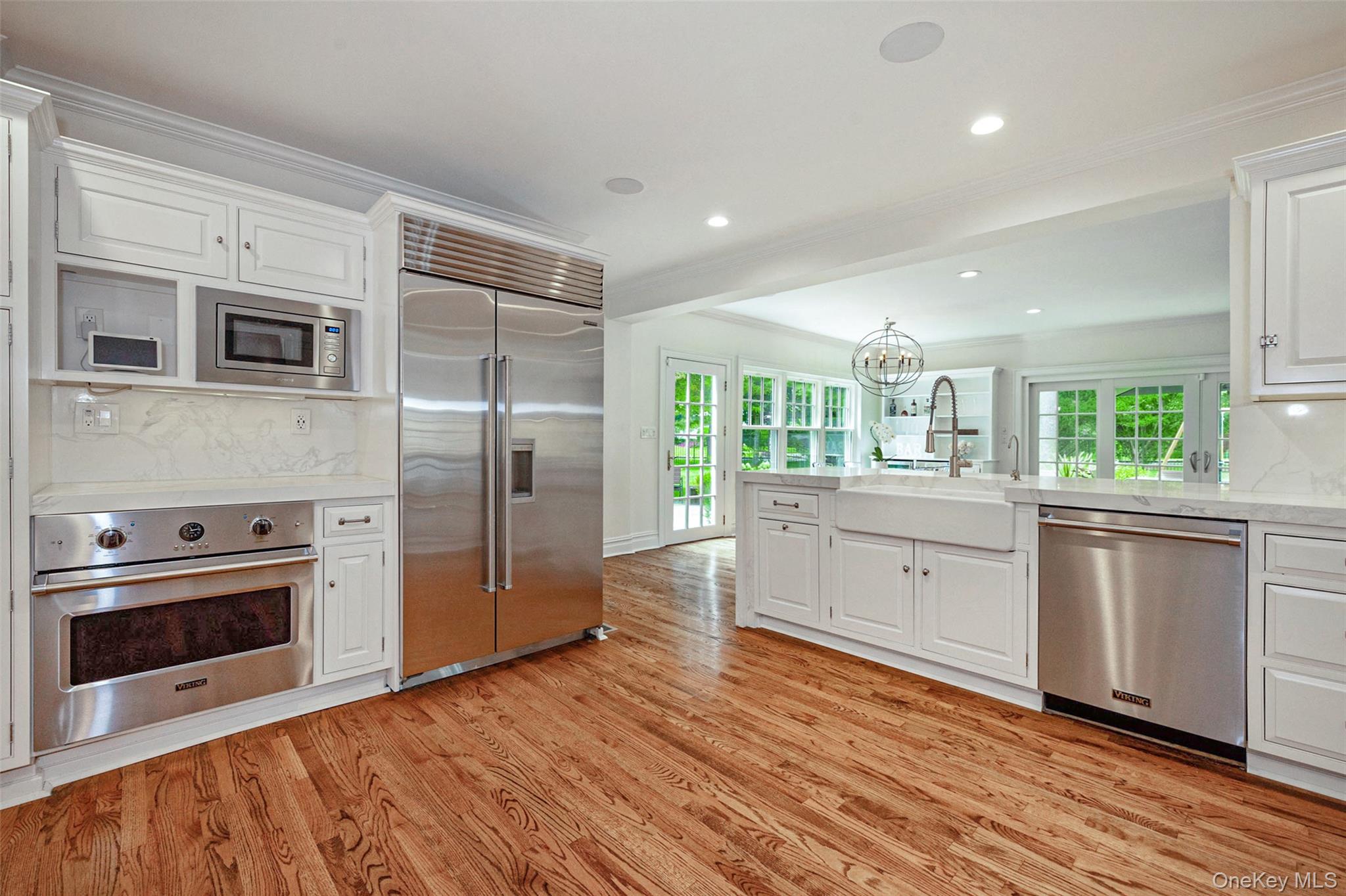 18 Lakeside Drive Rye, NY 10580 - Photo 12 of 43 a kitchen with stainless steel appliances granite countertop a stove a sink and a refrigerator