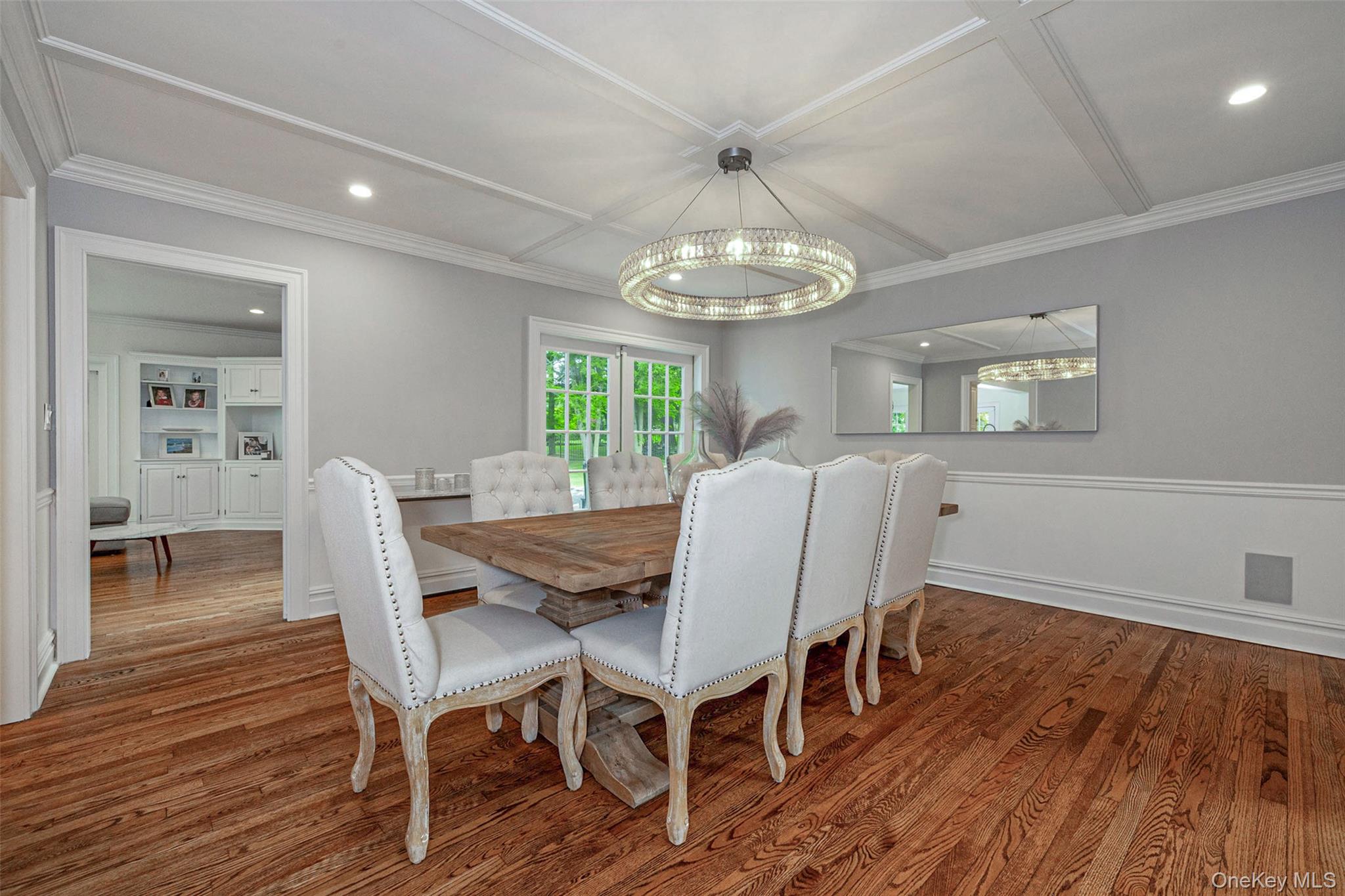 18 Lakeside Drive Rye, NY 10580 - Photo 20 of 43 a view of a dining room with furniture a chandelier and wooden floor