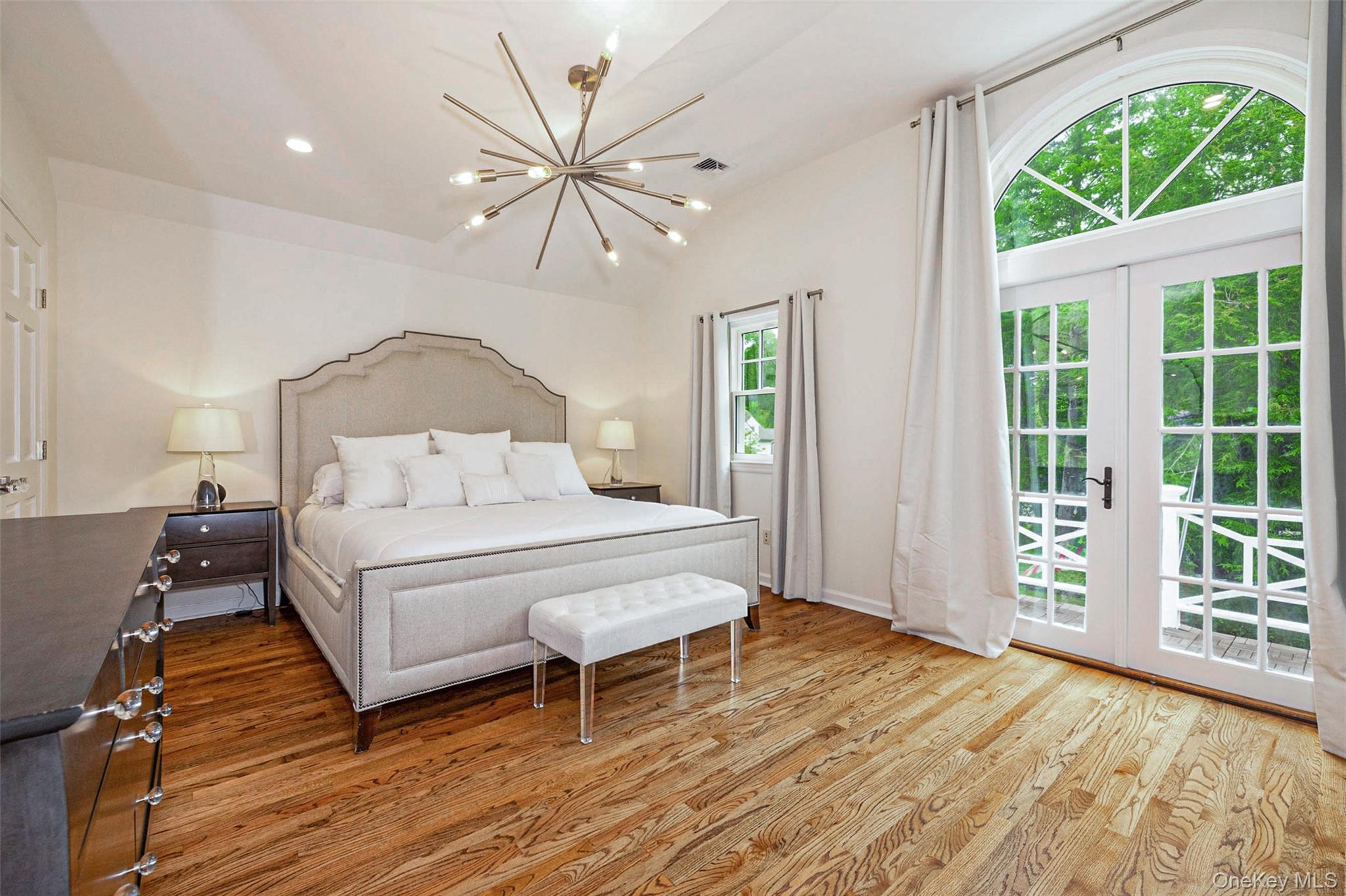 18 Lakeside Drive Rye, NY 10580 - Photo 21 of 43 a bedroom with a bed and a large window