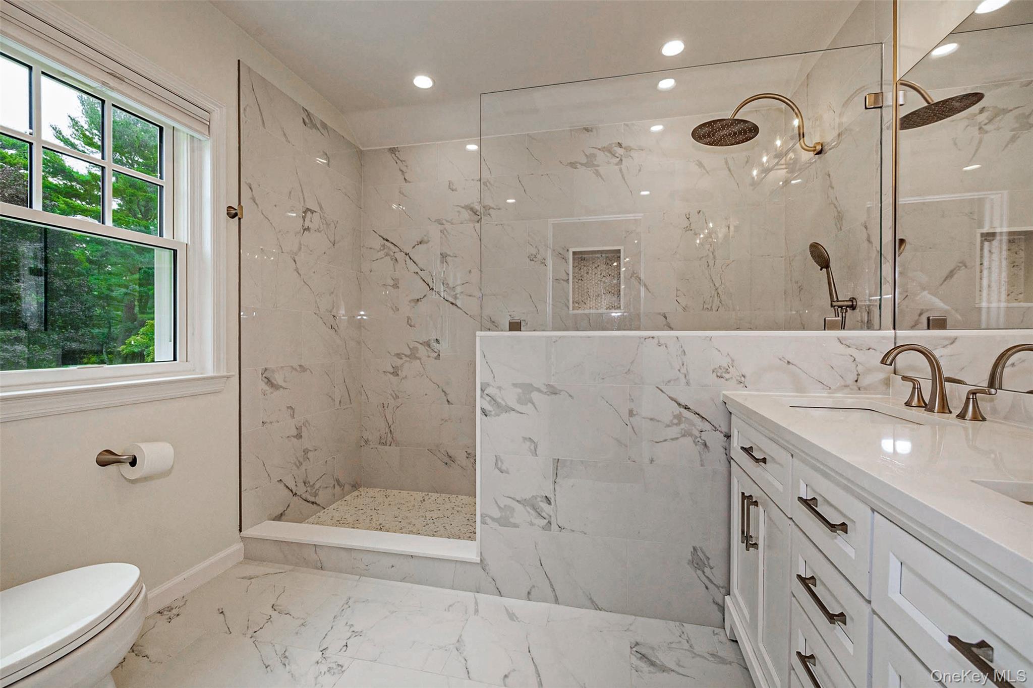 18 Lakeside Drive Rye, NY 10580 - Photo 23 of 43 a bathroom with a granite countertop sink a toilet and shower