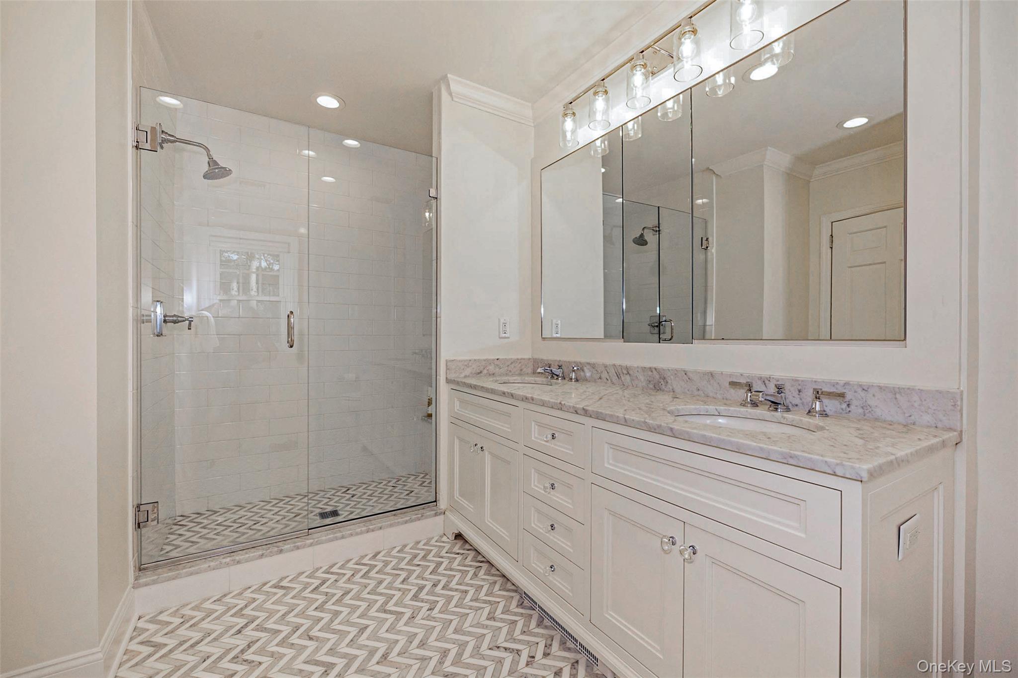 18 Lakeside Drive Rye, NY 10580 - Photo 27 of 43 a bathroom with a shower sink and mirror