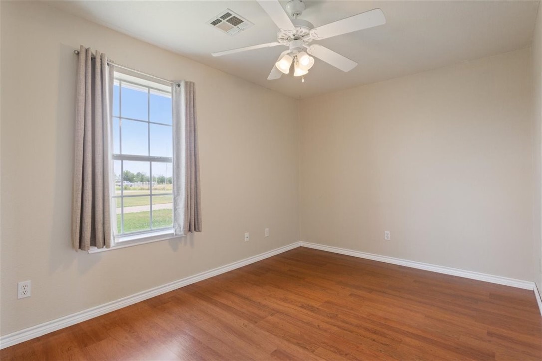 1045 Shiloh Trail China Spring, TX 76633 - Photo 26 of 35 wooden floor in an empty room with a window