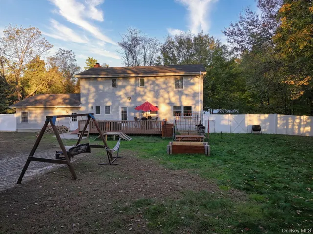 a view of a backyard with a tub