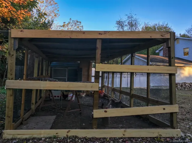 a backyard of a house with lots of green space and garden