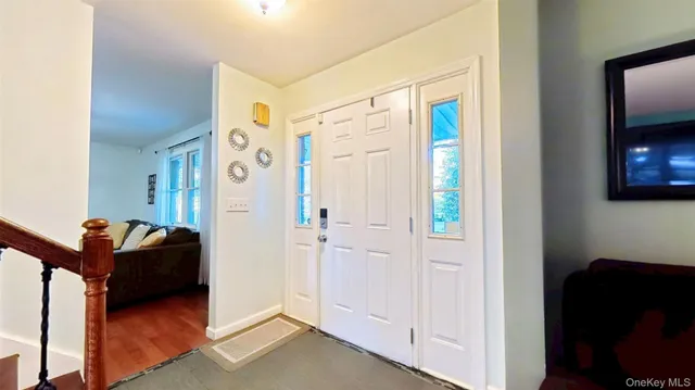a view of a livingroom with furniture and a flat screen tv