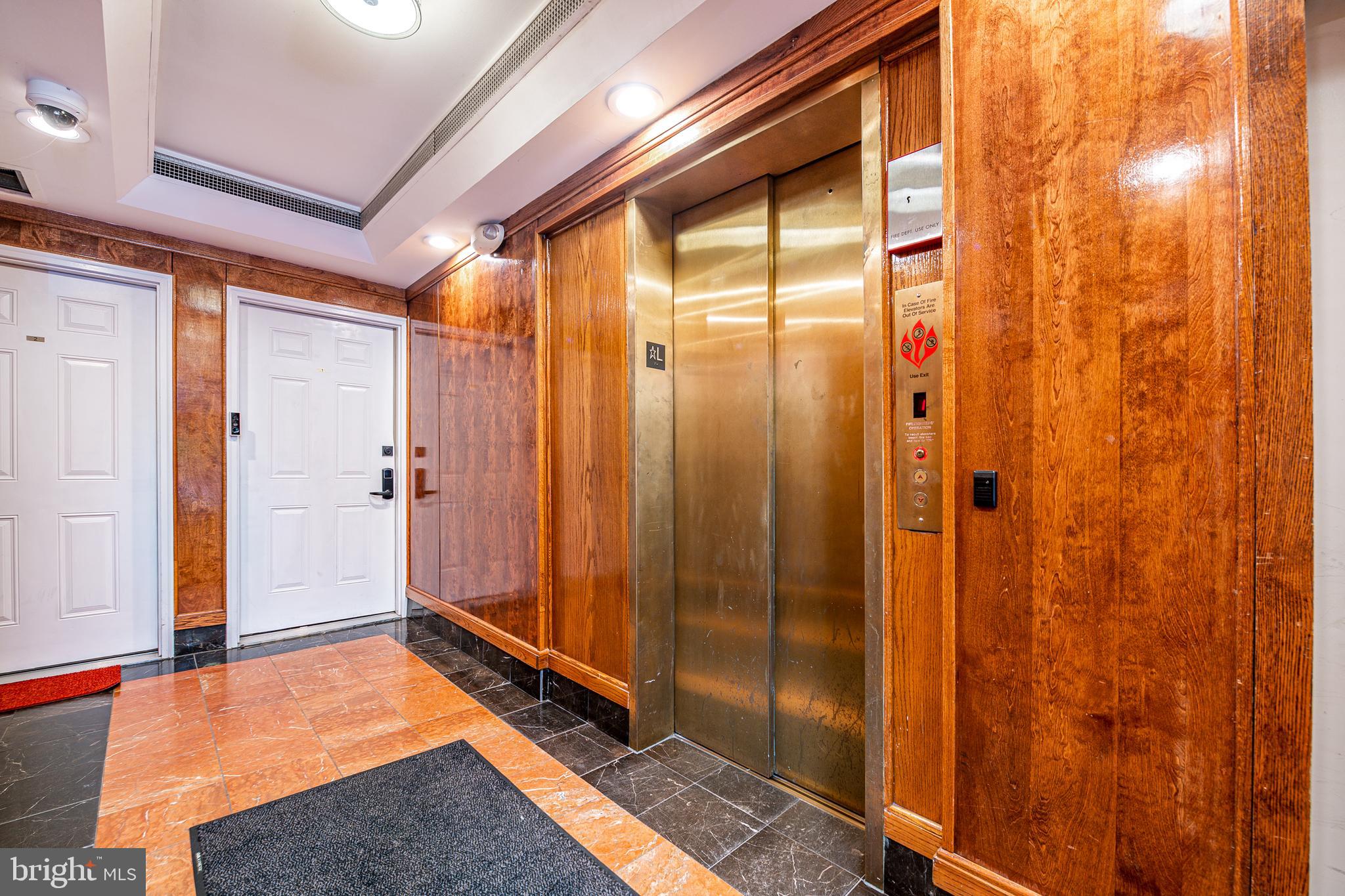 1125 12th Street Northwest, Unit 72 Washington, DC 20005 - Photo 4 of 36 Updated lobby with elevator