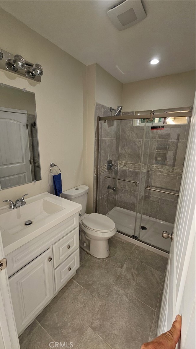 1344 Hardt Street San Bernardino, CA 92408 - Photo 10 of 12 a bathroom with a double vanity sink toilet and shower