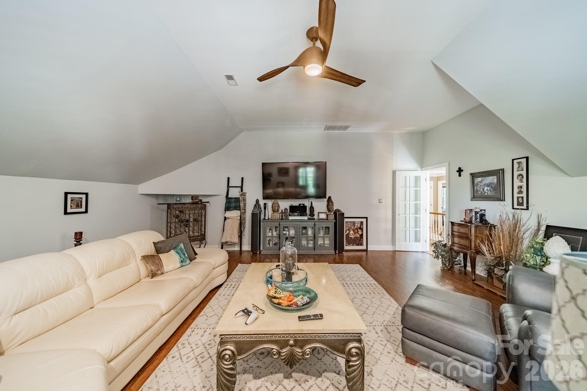 11043 Seven Coves Drive Tega Cay, SC 29708 - Photo 38 of 45 a living room with furniture and a flat screen tv