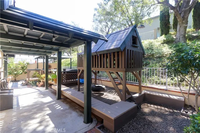 an aerial view of residential house with outdoor space and parking