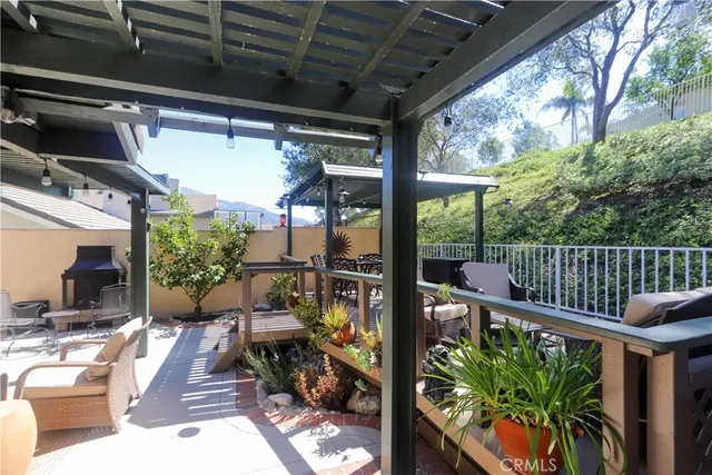 an aerial view of a house with a yard and garden