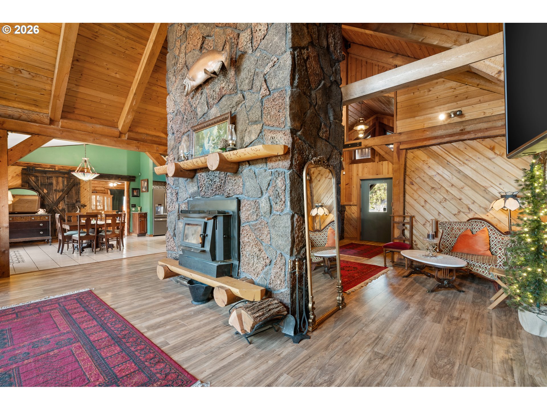 74091 Thornhollow Road Adams, OR 97810 - Photo 11 of 48 a living room with furniture a wooden floor and a fireplace