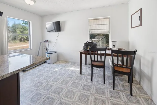 a kitchen with stainless steel appliances granite countertop a sink counter space cabinets and a window