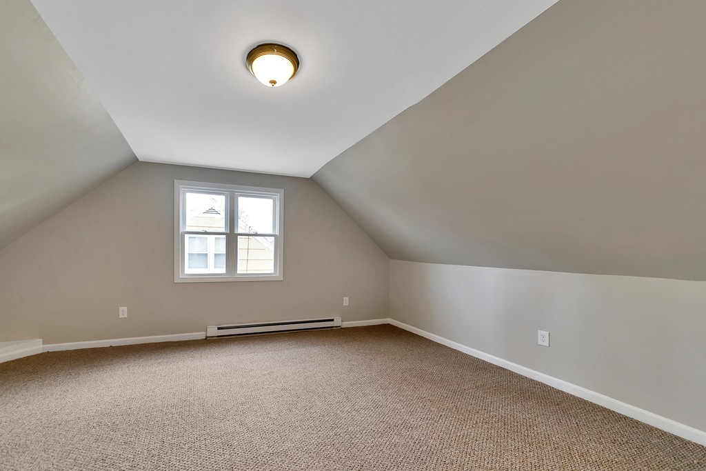 63 Haskin Street Springfield, MA 01109 - Photo 13 of 27 an empty room with windows and entrance
