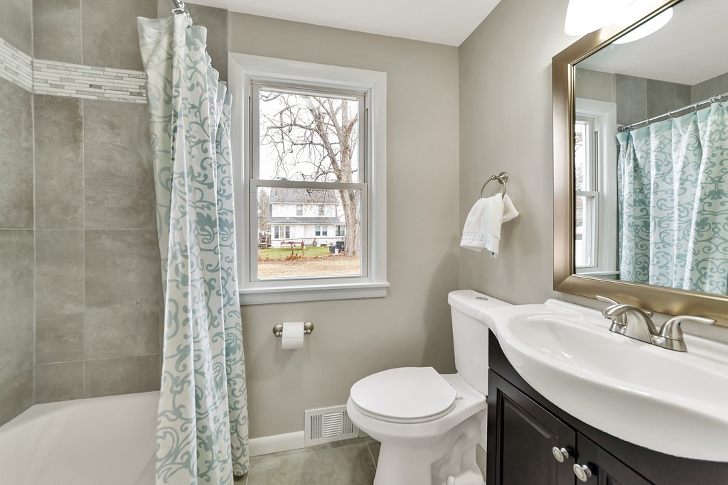 63 Haskin Street Springfield, MA 01109 - Photo 8 of 27 a bathroom with a sink toilet and shower