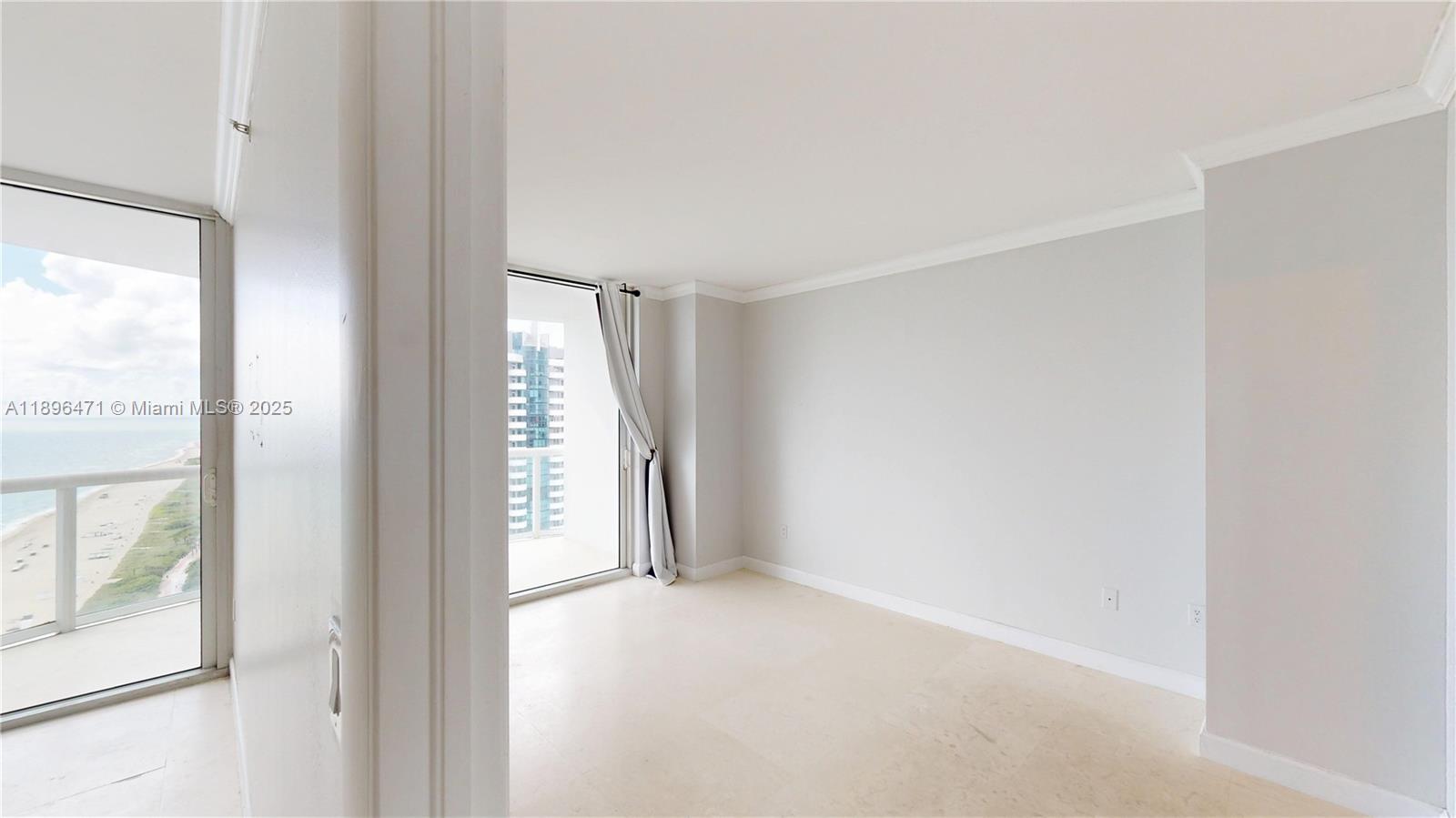 6365 Collins Avenue, Unit 2904 Miami Beach, FL 33141 - Photo 11 of 28 a view of an empty room and a window