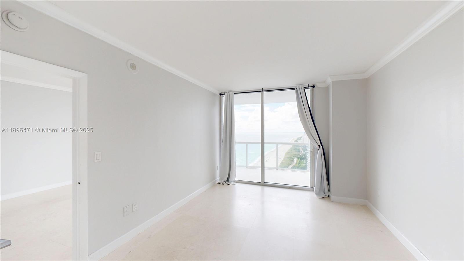 6365 Collins Avenue, Unit 2904 Miami Beach, FL 33141 - Photo 17 of 28 wooden floor in an empty room with a window