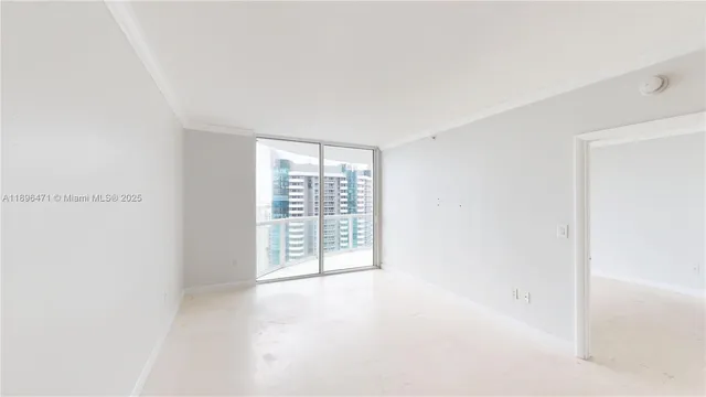 a view of an empty room with a window