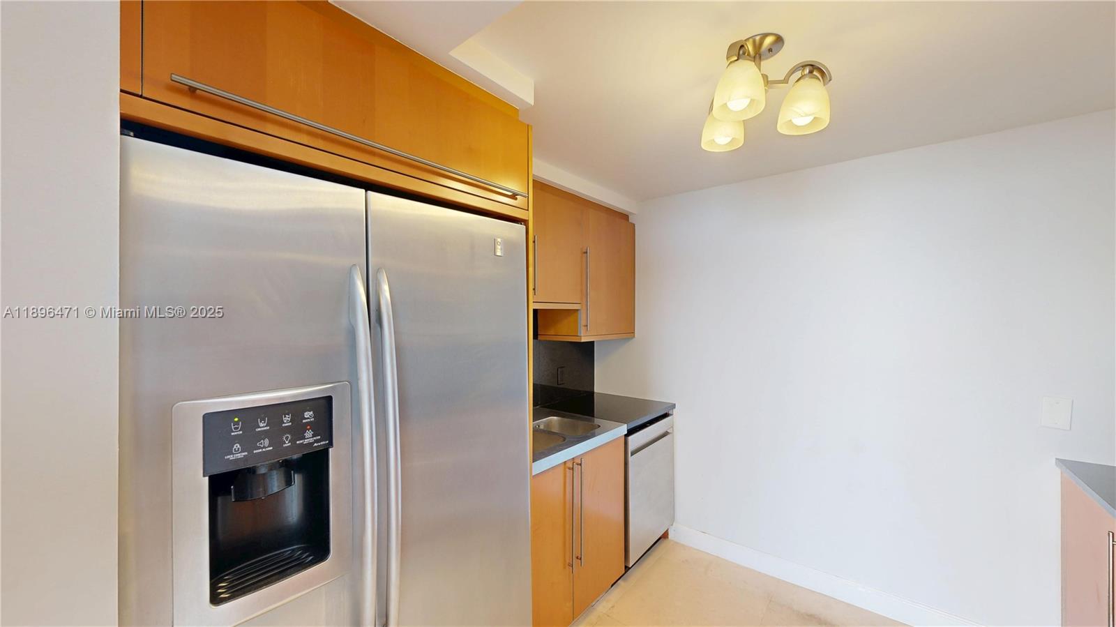 6365 Collins Avenue, Unit 2904 Miami Beach, FL 33141 - Photo 7 of 28 a bathroom with a walk in closet and a window