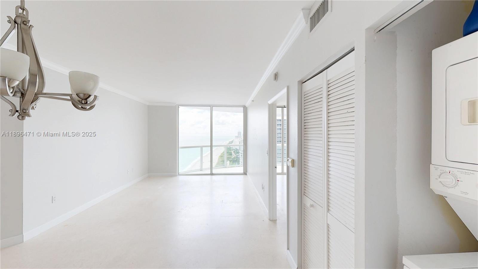 6365 Collins Avenue, Unit 2904 Miami Beach, FL 33141 - Photo 10 of 28 a view of an empty room with a window