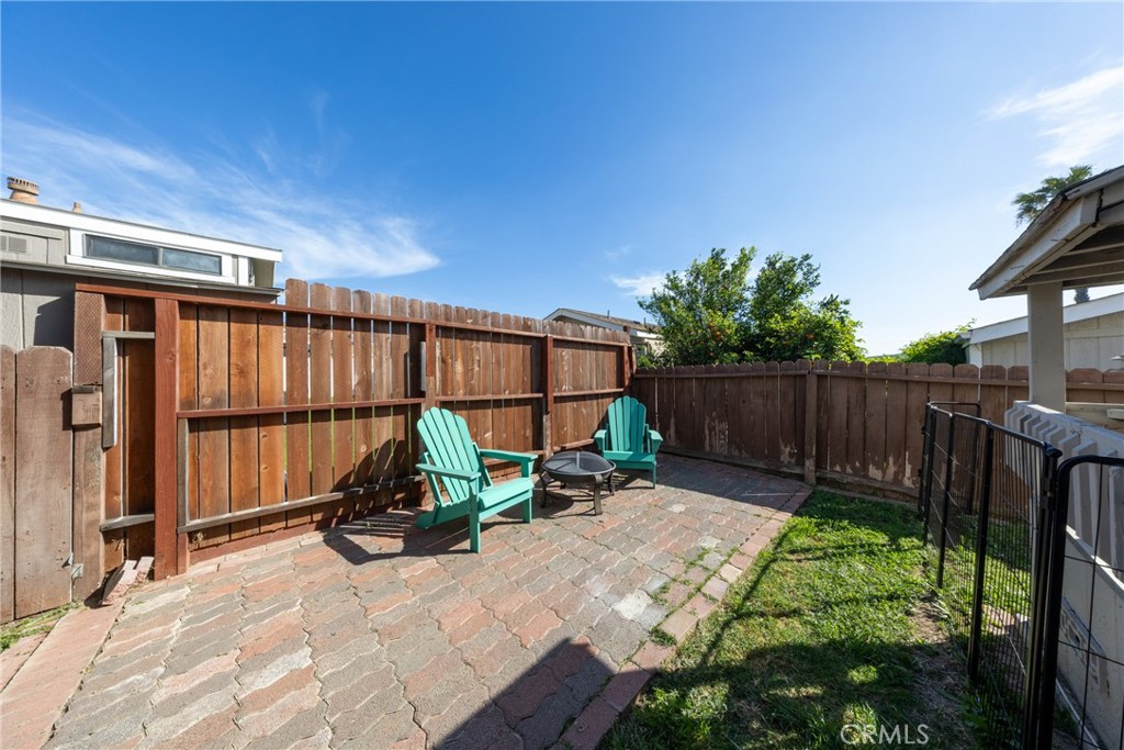 4080 Pedley Road, Unit 53 Jurupa Valley, CA 92509 - Photo 11 of 41 a view of backyard with wooden fence and a potted plant