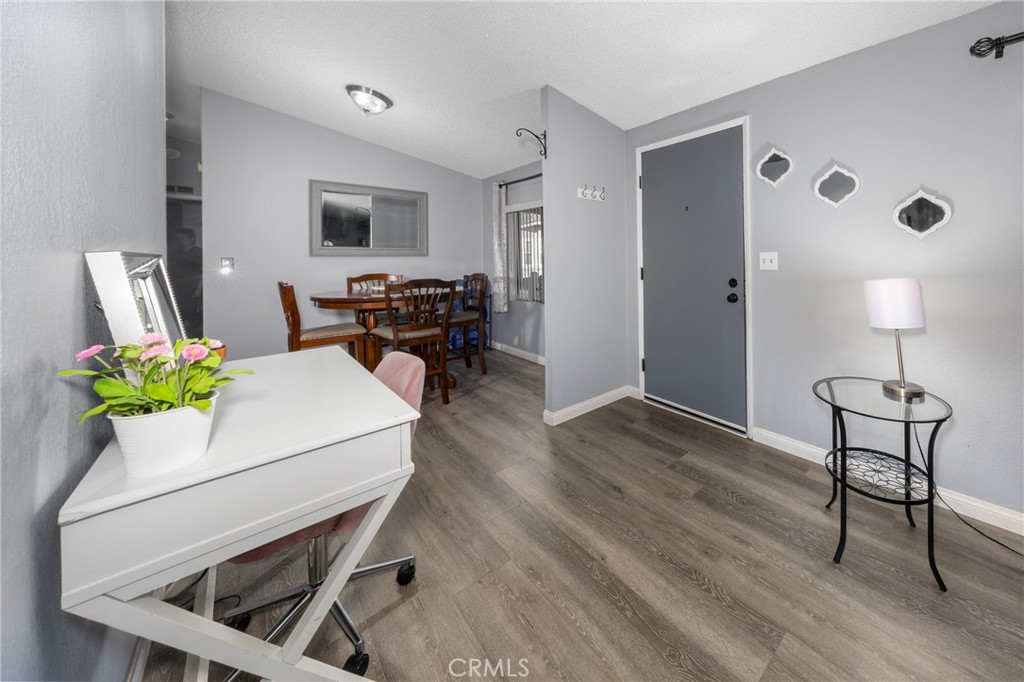4080 Pedley Road, Unit 53 Jurupa Valley, CA 92509 - Photo 13 of 41 a living room with furniture and a wooden floor