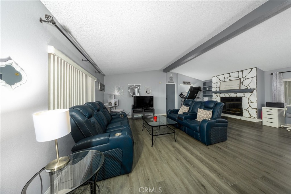 4080 Pedley Road, Unit 53 Jurupa Valley, CA 92509 - Photo 14 of 41 a living room with furniture and a fireplace