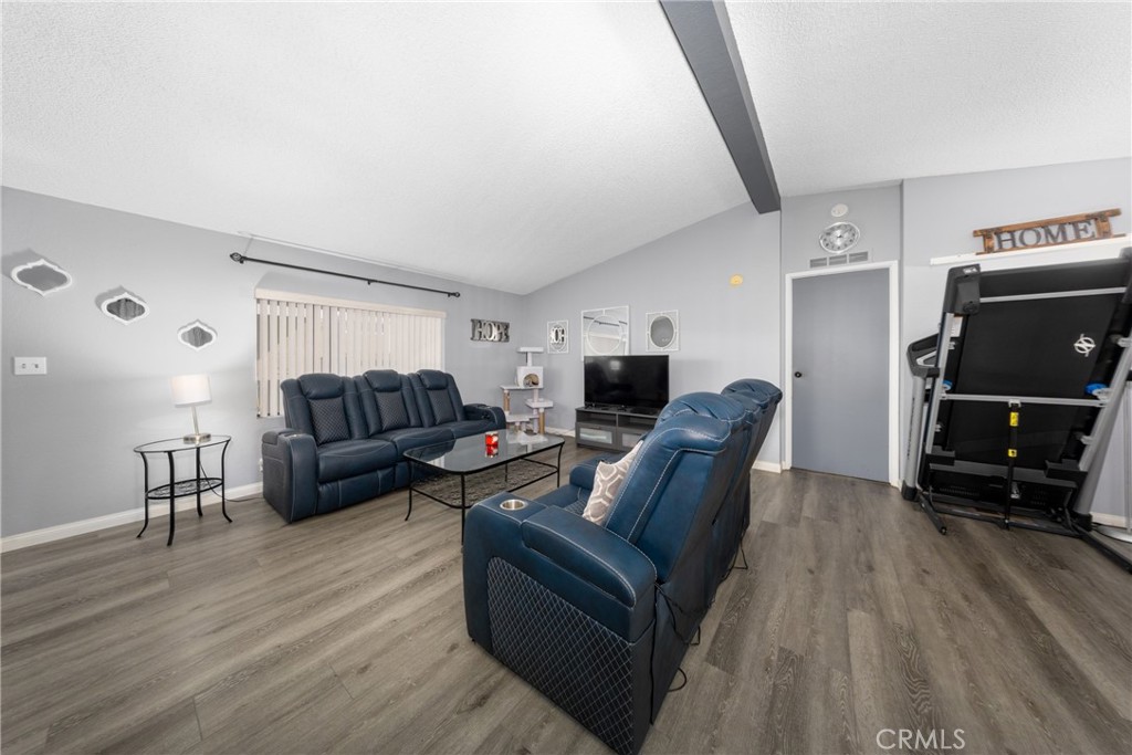4080 Pedley Road, Unit 53 Jurupa Valley, CA 92509 - Photo 15 of 41 a living room with furniture and a flat screen tv