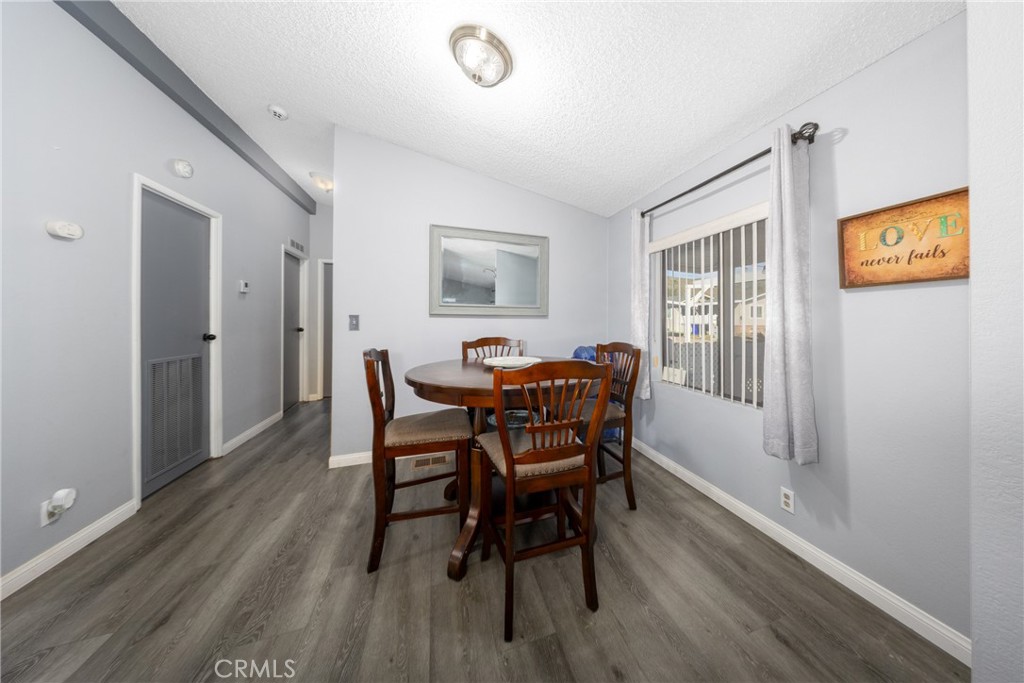 4080 Pedley Road, Unit 53 Jurupa Valley, CA 92509 - Photo 17 of 41 a view of a dining room with furniture and wooden floor