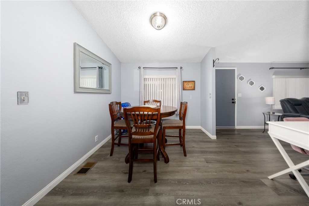 4080 Pedley Road, Unit 53 Jurupa Valley, CA 92509 - Photo 18 of 41 a view of a livingroom with furniture and wooden floor