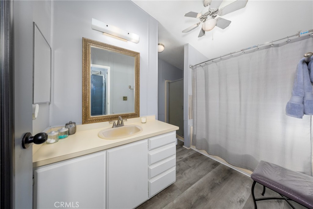 4080 Pedley Road, Unit 53 Jurupa Valley, CA 92509 - Photo 25 of 41 a bathroom with a sink and a mirror