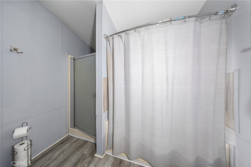 4080 Pedley Road, Unit 53 Jurupa Valley, CA 92509 - Photo 26 of 41 a bathroom with a shower and a tub