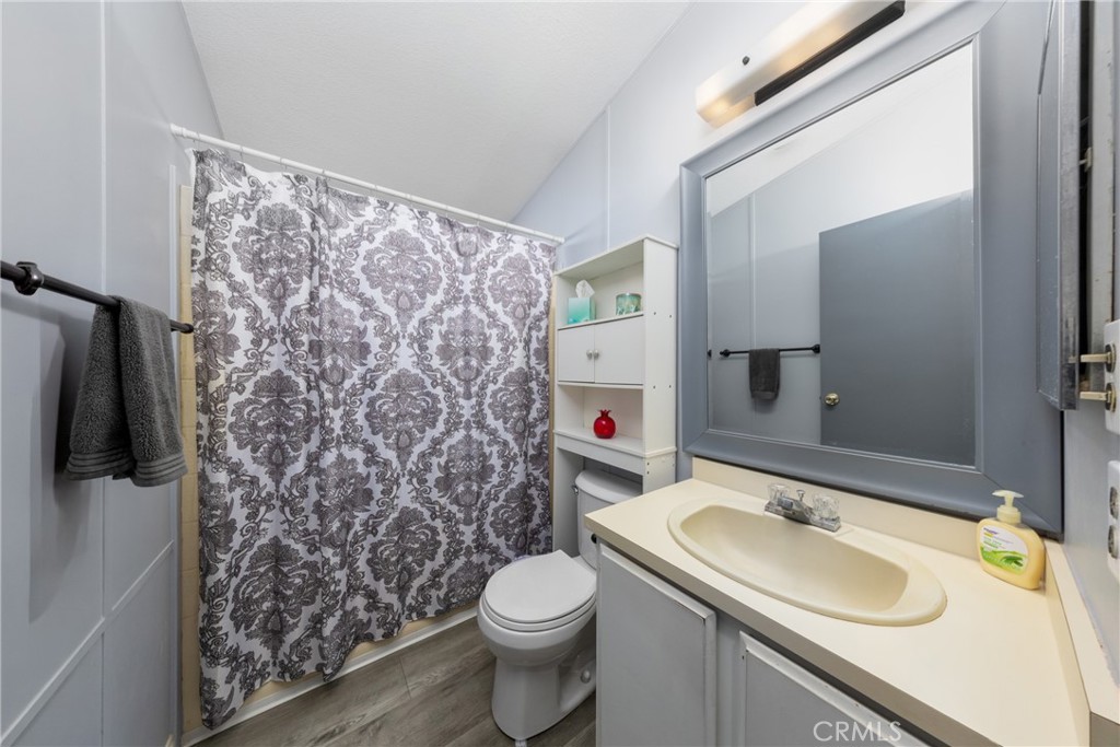 4080 Pedley Road, Unit 53 Jurupa Valley, CA 92509 - Photo 28 of 41 a bathroom with a sink toilet and shower