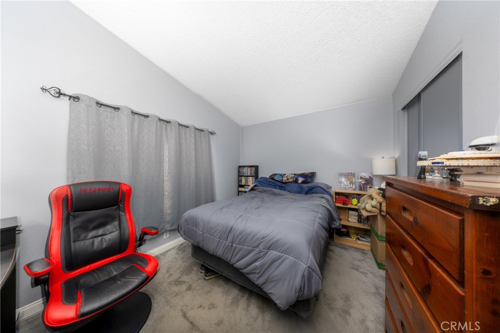 4080 Pedley Road, Unit 53 Jurupa Valley, CA 92509 - Photo 29 of 41 a bedroom with bed and a wooden floor