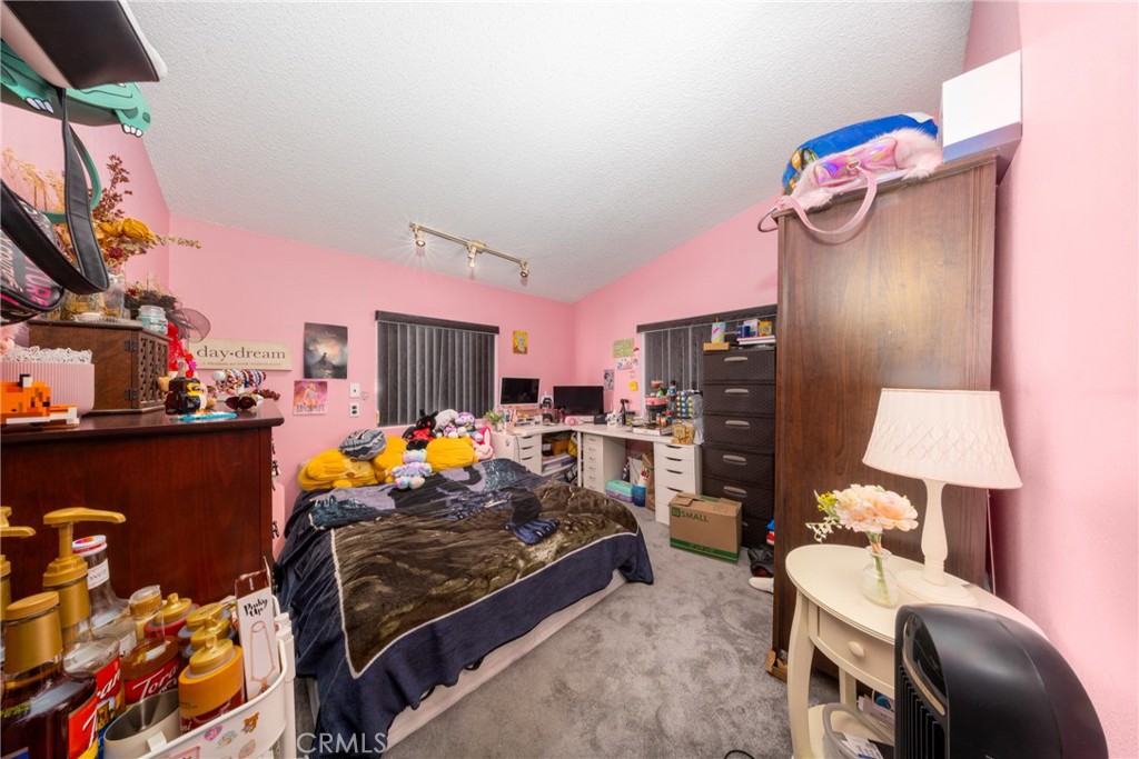 4080 Pedley Road, Unit 53 Jurupa Valley, CA 92509 - Photo 31 of 41 a bedroom with furniture and a lamp