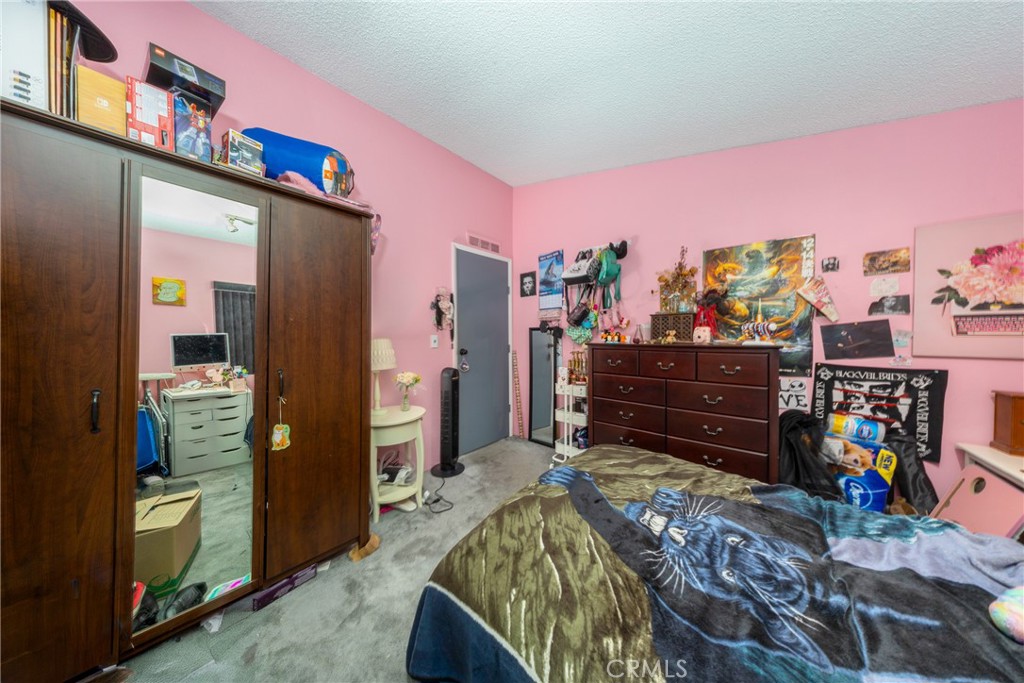 4080 Pedley Road, Unit 53 Jurupa Valley, CA 92509 - Photo 32 of 41 a bed room with a bed and a television