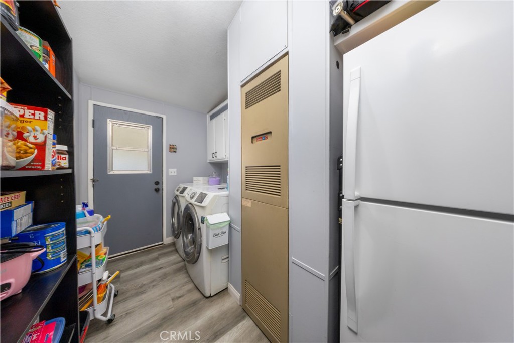 4080 Pedley Road, Unit 53 Jurupa Valley, CA 92509 - Photo 33 of 41 a view of walk in closet with clothes and shoes