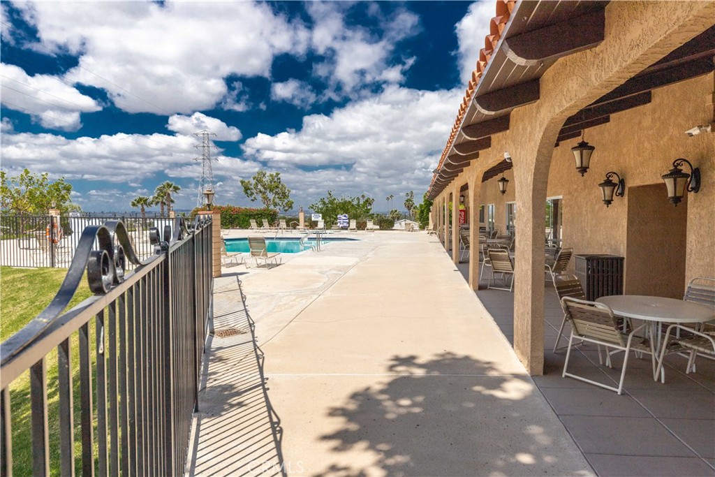 4080 Pedley Road, Unit 53 Jurupa Valley, CA 92509 - Photo 35 of 41 a view of a balcony with wooden floor and bench