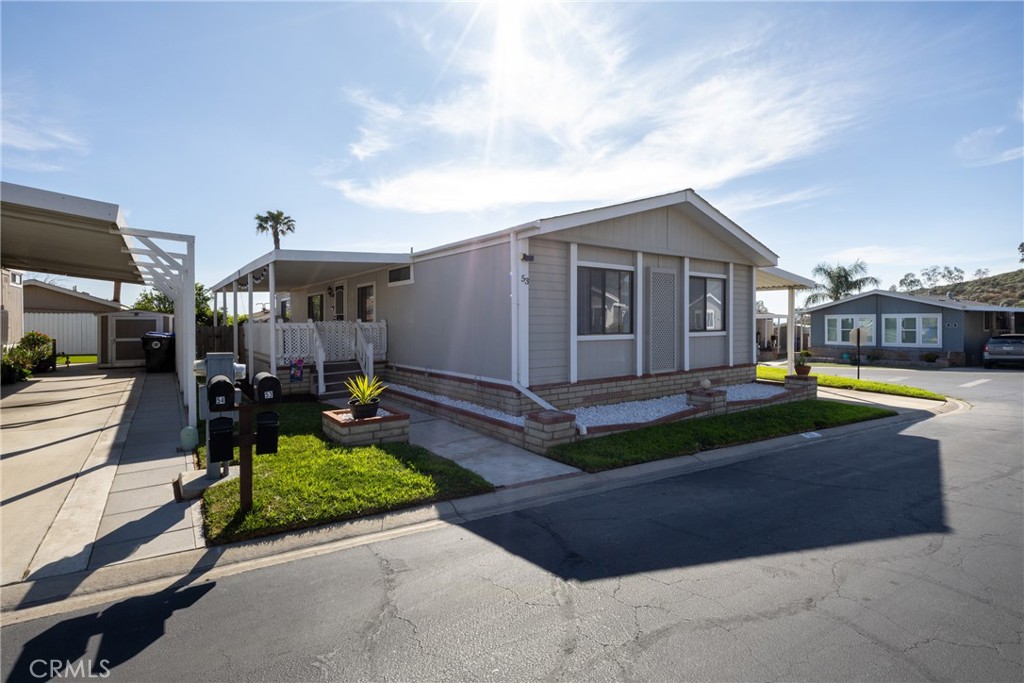 4080 Pedley Road, Unit 53 Jurupa Valley, CA 92509 - Photo 6 of 41 a view of a house with swimming pool and sitting area
