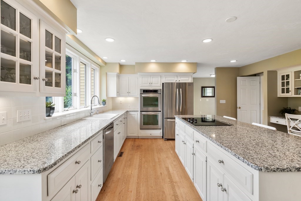 181 Maple Street Sherborn, MA 01770 - Photo 12 of 41 a large kitchen with stainless steel appliances granite countertop a large counter top and a sink