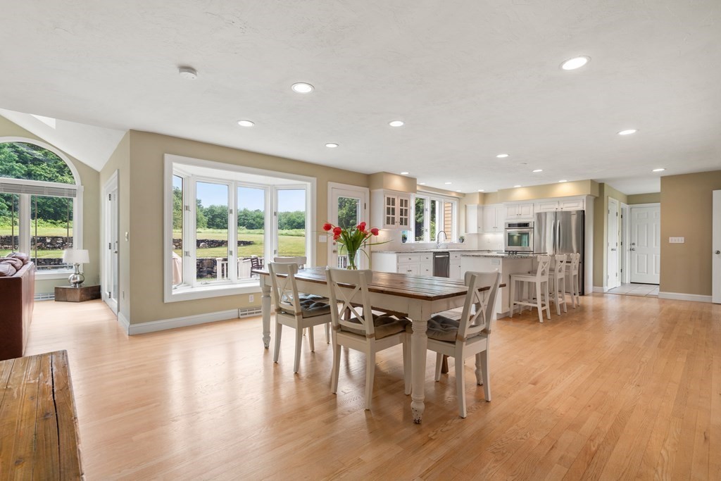 181 Maple Street Sherborn, MA 01770 - Photo 15 of 41 a view of a dining room with furniture and wooden floor
