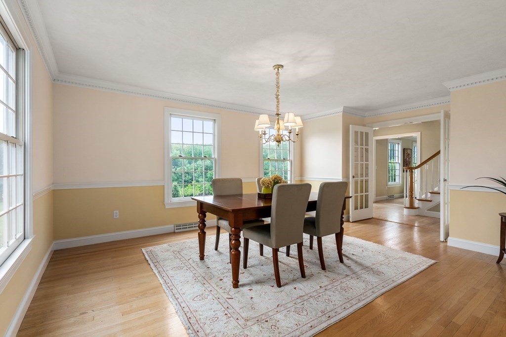 181 Maple Street Sherborn, MA 01770 - Photo 16 of 41 a view of a dining room with furniture window and wooden floor