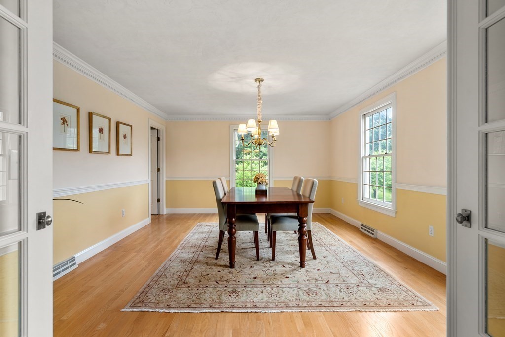 181 Maple Street Sherborn, MA 01770 - Photo 17 of 41 a living room with dining table and a window