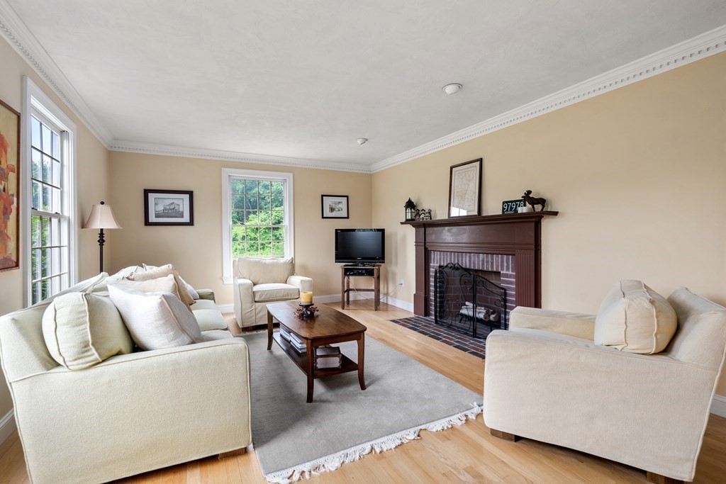 181 Maple Street Sherborn, MA 01770 - Photo 18 of 41 a living room with furniture and a fireplace